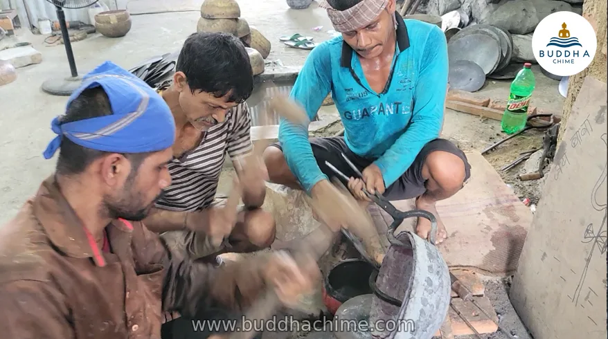 Nepali artisans hand-hammering a Tibetan singing bowl